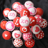 Valentine Cupcakes I made these cupcakes to take to my Cake Club meeting tonight. Strawberry cupcakes with buttercream frosting topped with fondant accents....