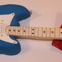 Guitar Cake This was for an 11 year old's birthday to match his guitar and it's BIG...from end to end, it's 34 inches. Everything is...