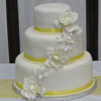 Yellow Ribbon Wedding Cake Cake done with 6, 9, and 12-inch tiers.