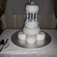 Hearts Wedding Cake This is five 6 in cakes in a circle with a 10 in, 8 in, pillars, then a 7 in. cake. It iis choc. and vanilla with a choc. pudding filling...