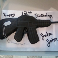 M16 Cake BC with fondant accents. Consulted with the lady the cake was for and she opted to have a more stocky 'stock' for the gun to...