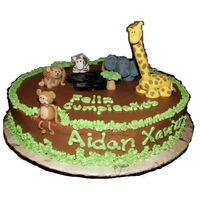 Jungle Cake This was my son's 1st B-day cake. Cream bouquet flavored yellow cake with Nutella buttecream frosting. All figurines are made of...
