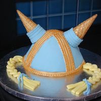 Viking Helmet Made with the wondermold pan. Fondant with ice cream cones for horns. I tried making the horns from Rice Krispie treats, but I couldn'...