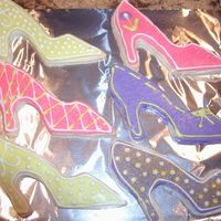 Shoe Cookies I made these for a friend. We have a running joke about her boring choices in footwear, so I made her some "purty" shoes. ;)