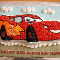Lightning Mcqueen From Cars I used the Wilton shaped pan and then placed it on a sheet cake to increase the servings.