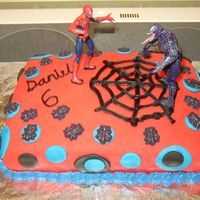 Spiderman Covered in red fondant. I used black chocolate and a candy mold to make the spiders.