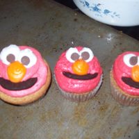 Elmo Cupcakes Yellow cake with oreo's without the filling for a smile, and milk chocolate chips as eyes. TFL