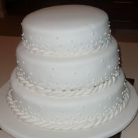 Nicks_Wed.jpg First wedding cake, for family. A little uneven so I was disappointed but DH's family didn't even notice. Camera battery went...