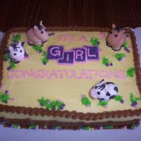 Western Baby Shower Cake Western/cowgirl baby shower cake. Fence design on sides, fondant molded cows and horses, colors of baby shower were yellow, purple and pink...
