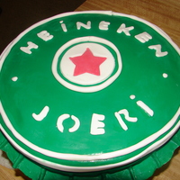 Beer Cap Cake- Husbands Birthday this is a heinken Beer cap. This cake is covered in Fondant