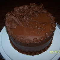 Chocolate Cake This was for a friend. This was a very uneven cake and I tried to compensate by overloading it with flowers. LOL It didn't really work...