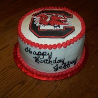 Jeffrey's Cake South Carolina Gamecocks birthday cake for my son. He loved it. The emblem is royal icing. Tuxedo cake, white chocolate and milk chocolate...