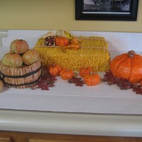 Fall This is a cake I did for a fall picnic.This was so fun to do. Everything is cake except the indian corn( RKT covered w/fondant.