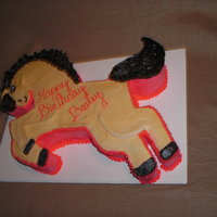 Pony Cake Large pony-shaped cake for a girl's birthday. All buttercream. Cut from a template made from an enlarged coloring book page. It was A...