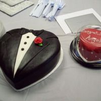 Tuxedo Cake & Heart Along with bride's bodice cake, made for company congratulations party. Covered in fondant. Sugar pearls on side of heart.