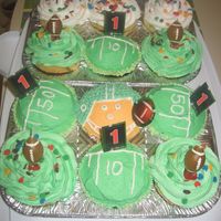 My First Attempt At Cupcakes My quarterback looks a little more like a muppet, but I had a blast making these for a friend's birthday.