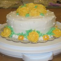 Final Cake--Course 1 I've learned the hard way to be sure to put my cake caddy flat on the floor of my car...the roses on the bottom are used to hide where...