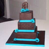 Chocolate/ Turquoise Cake Was Marble with Ganache Filling.Chocolate BC and Gum Paste Gerberia Daisies