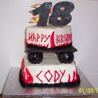 Cody's 18Th Birthday Top tier is yellow Bottom tier is chocolate ~ covered in buttecream with fondant accents ~ The "18" was carved gumpaste &...