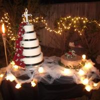 Roses This is a vanilla cake with BC filling 5 tierd round cake coverd in BC with fresh roses cascading down the left side. This was my first 5...