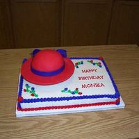 Red Hat Hat was 1/2 ball covered w/fondant. The rest of the cake was marble with buttercream frosting.