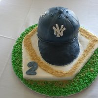 Baseball Cap Grooms Cake Thank You for everyone's help on this one.. chocolate cake for cap, base was buttered cake and cakes were covered in fondant. The brim...