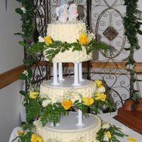 Dsc_11630186.jpg Icing is buttercream and flowers are fresh. This was my first cake w/ columns. I couldn't have done it without my husband! Thanks for...