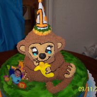 Monkey Cake Clayton's first birthday cake a monkey (white cake with sprinkles inside) and he is sitting on a 16" round strawberry french...