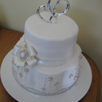 Wedding Cake First wedding cake I've made. 8" round WASC with white chocolate mousse filling, 12" petal shape lemon cake with buttercream...