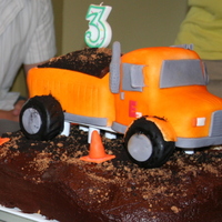 3D Dump Truck Cake The bottom portion of the cake is 4 13x9 sheet cakes, layer with cookies and cream filling and topped with chocolate icing and Oreo and...