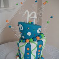 Whimsical Birthday Cake 10" and 8" tapered cakes. All decorations are fondant.