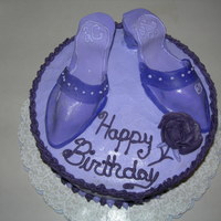Shoe Cake This is my first time amking shoes out of fondant. I put the shoes on the wrong side, and they were a little bent. This is my birthday cake...