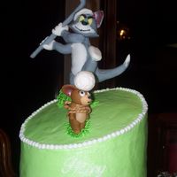 Tom And Jerry Golf A cake i did for my uncle's birthday. He is a big golf fan and my son is a big Tom and Jerry fan so i tried to combine the two.