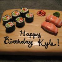 Sushi Cake 9 x 13 sheet cake covered in fondant with handpainted woodgrain. Modelled fondant Sushi pieces.