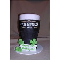 Guinness Pint 12" fondant covered cake I made for my husband's birthday (on St. Patty's Day!). I free-handed all the writing using royal...