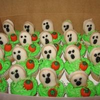 Boo! Halloween themed cupcakes made for my 3 GD classes at school. (96 cupcakes total) Decorations are :Nutter butter covered w/ petit four...