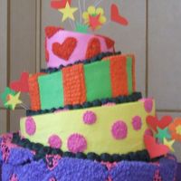 Pasteles_050.jpg This is my first whimsical/topsy-turvy cake, I kind of messed up on the bottom one because when I was putting it together it broke from the...