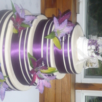 Purple Lilies And Ribbon stryofoam dummy made for a bride , covered in mmfpurple ribbons and silk lilies