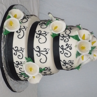 Black Scrolls And Calla Lilies marble cake with almond buttercream covered in mmf50/50 for the call lilies thanks for looking