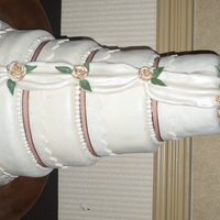 Copper Tipeed Roses, Swag vanilla cake with raspberry filling, covered in mmf roses are mmf with copper tips , lace from a mold and real ribbonthanks for looking