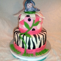 Eeyore 21St Birthday A birthday cake for an Eeyore collector. Eeyore is gumpaste, and is sitting on a giant gumpaste daisy. Cake is MMF.