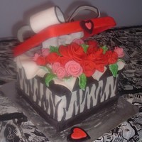 Zebra Gift Box With Roses 8" square, 3 layers. Fondant coverings and decorations. Lid is made from gumpaste molded on a cake pan.