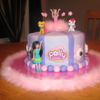 Polly Pocket Cake Vanilla/Vanilla cake covered in fondant w/ polly's on top etc. Inspired by MommaLlama's polly pocket cake :o) thanks for looking...