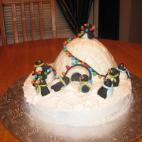 Christmas Penguins Vanilla cake with Vanilla frosting. All decorations are made from Satin Ice fondant. Thanks for looking!! :o)