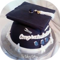 Graduation Sat 0509 Larger wonder mold covered in fondant. WASC w/ pineapple filling. YUMMY!!