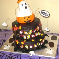 Halloween B-Day I made this cake with my best friend, I took care of the pumkin and ghost on top, and all the flying ghosts and bats around the cake. Both...