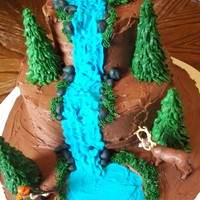 Hunting Birthday Cake Hunting themed birthday cake. Covered in chocolate buttercream with buttercream and fondant accents. figures are plastic