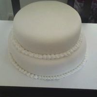 Firstcake.jpg My VERY 1st cake using fondant!! It was for a couples 30th anniversary. They came to Houston to get it & Ended up taking it all the way...