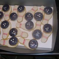 Bowlingcookies.jpg Bowling cookies to match the bday cake! Used fondant to cover the cookies..