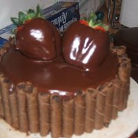 His Proud Moment Kahlua fudge cake with mocha filing and Shirley's chocolate glaze on cake and strawberries. I made this for my husbands graduation...